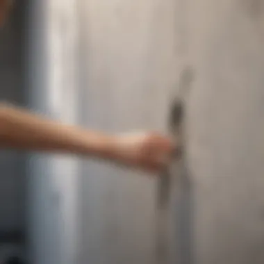Woman sealing a crack in the wall with caulk