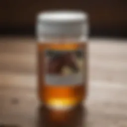 Container of horse liniment on a wooden surface