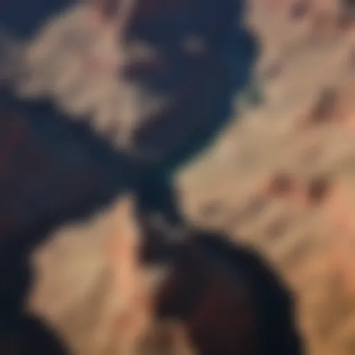 Aerial view capturing the expansive majesty of the Grand Canyon's colorful rock formations