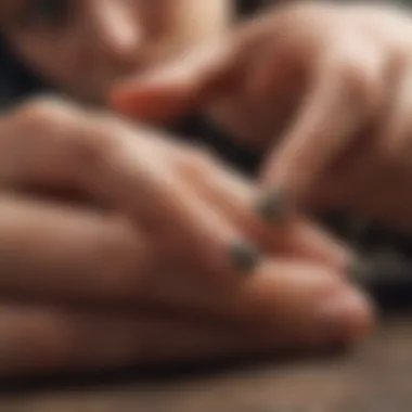 Cat owner applying nail caps to feline's claws